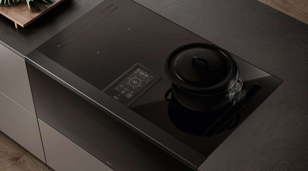 Meet Elica LHOV: A Game-Changing Hood, Oven, and Induction Hob Elica LHOV induction hob with built-in hood for efficient air extraction over the cooking surface.